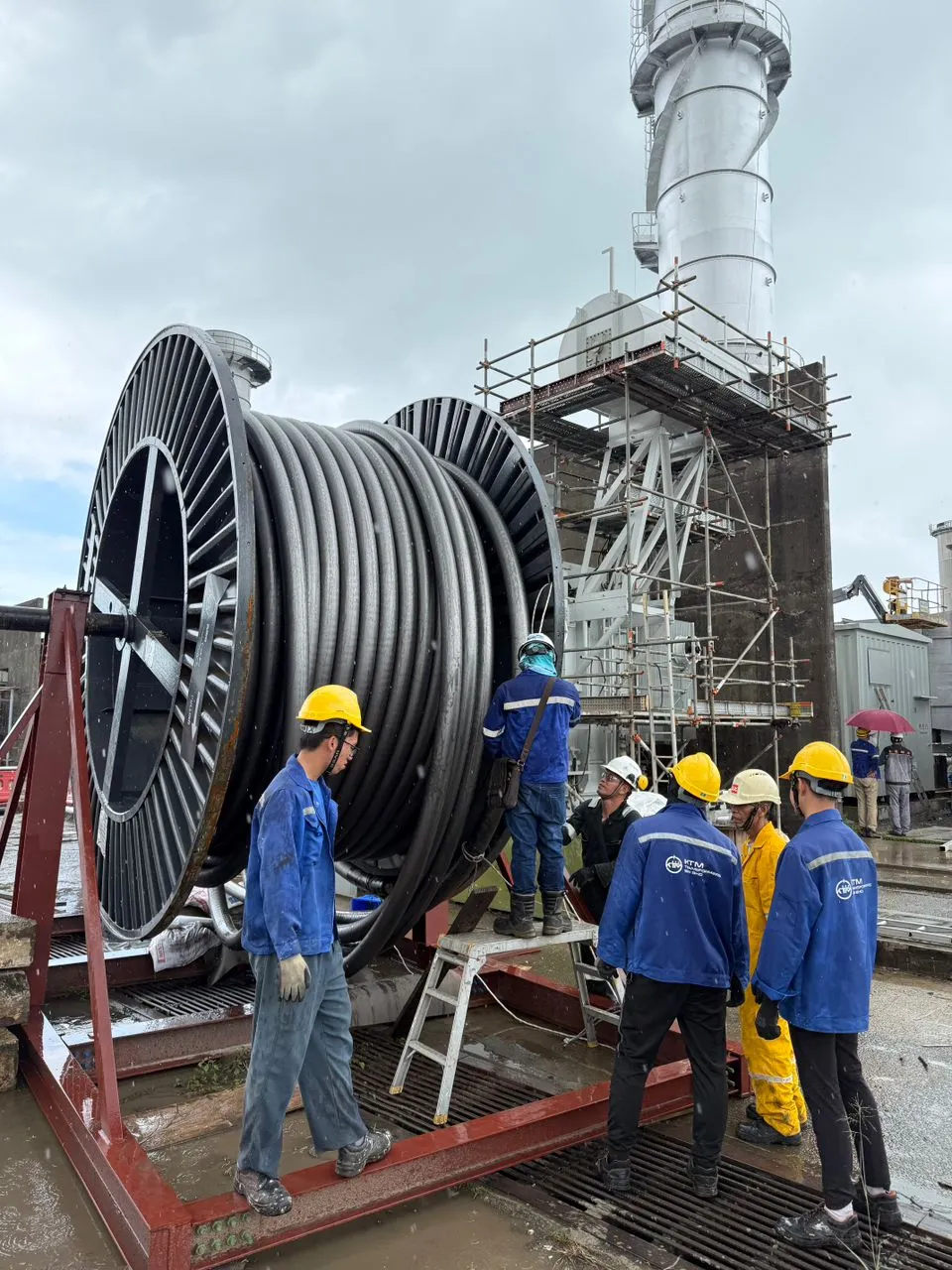 A large cable drum on site at a power station.