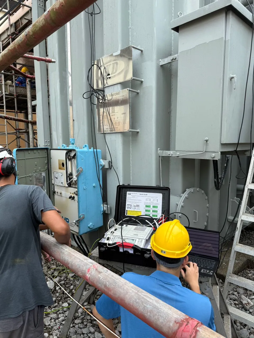 Portable transformer diagnostic test set connected on site.