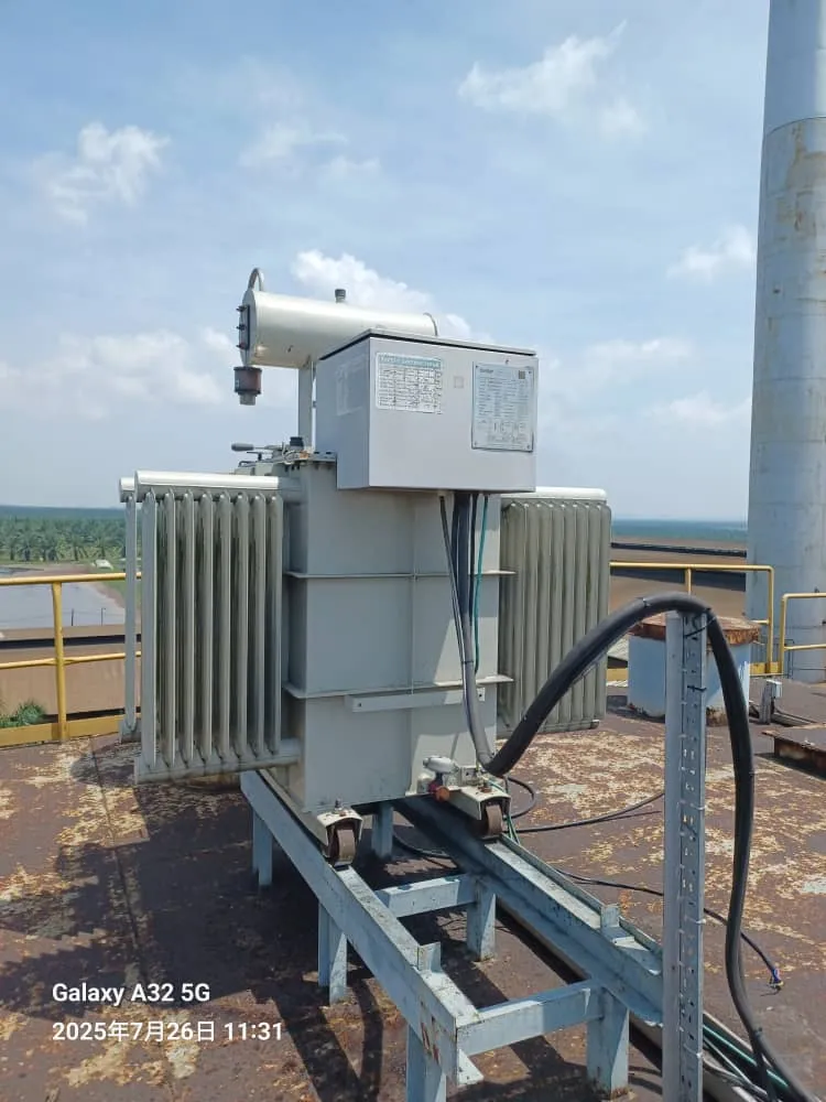 A distribution transformer installed on a steel platform.