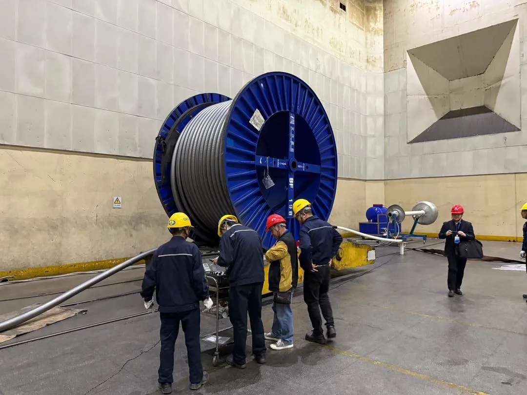 A cable drum positioned in a high-voltage test hall.