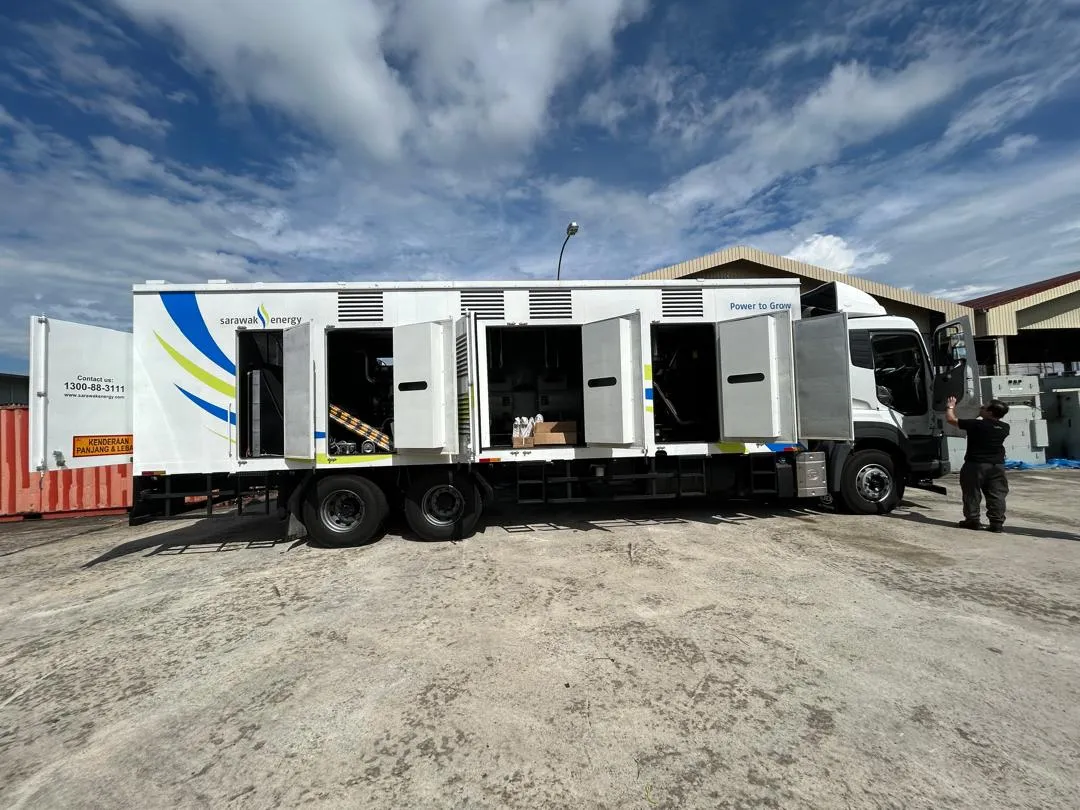 A fleet of lorry-mounted mobile generator sets ready for delivery.