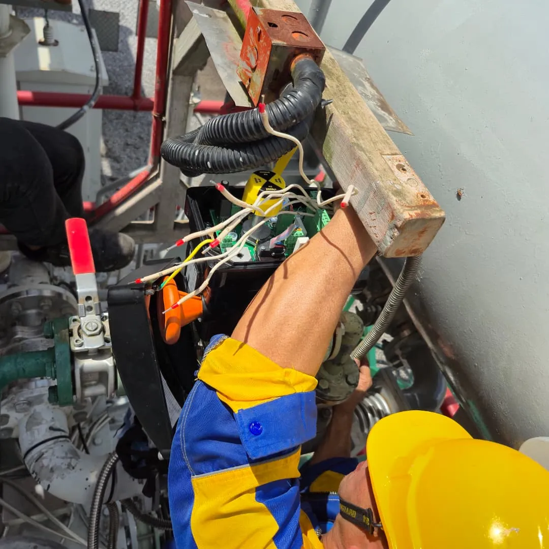 A SERGI transformer protection system being installed on a transformer.