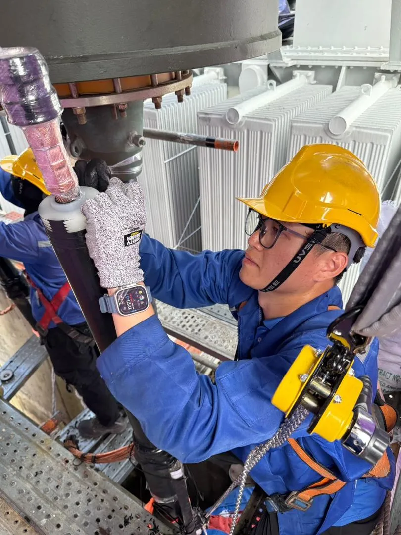 A KTM Transformers technician working on transformer equipment on site.