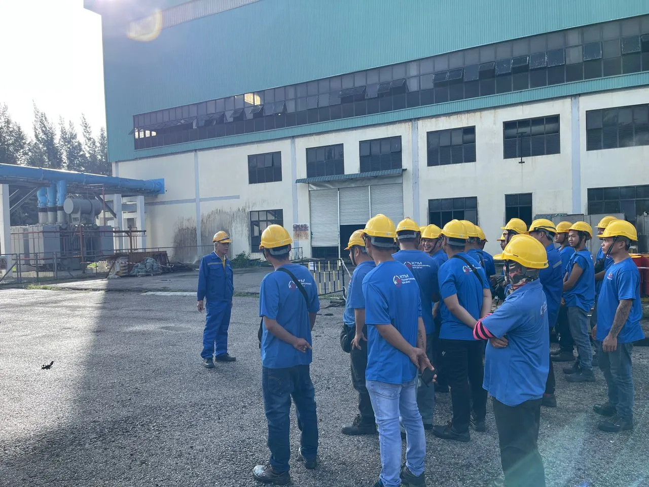 The KTM Transformers team gathered outside the company workshop in Kuching, Sarawak.